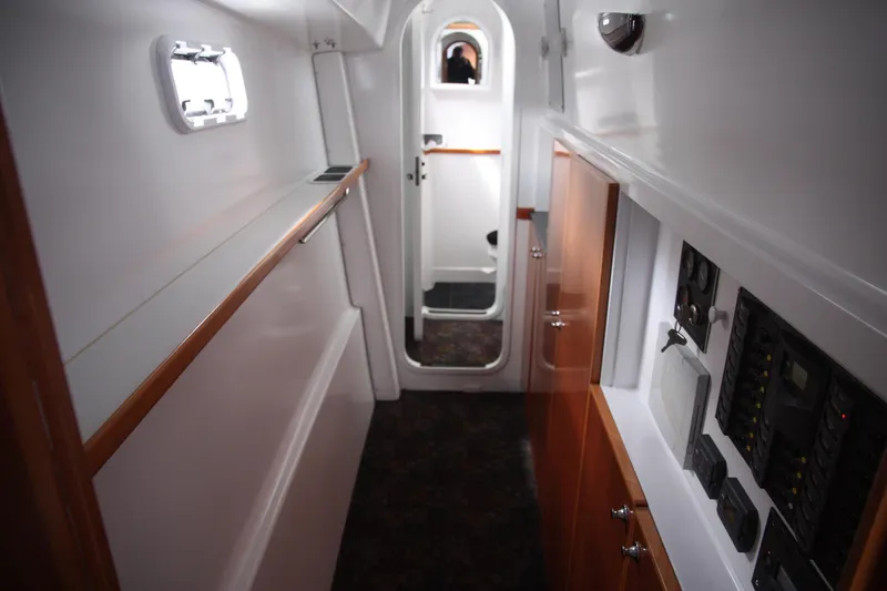Slide: The Image of Interior of 2004 TLD Custom Power Cat, featuring control panels and sleek cabinetry. - 12