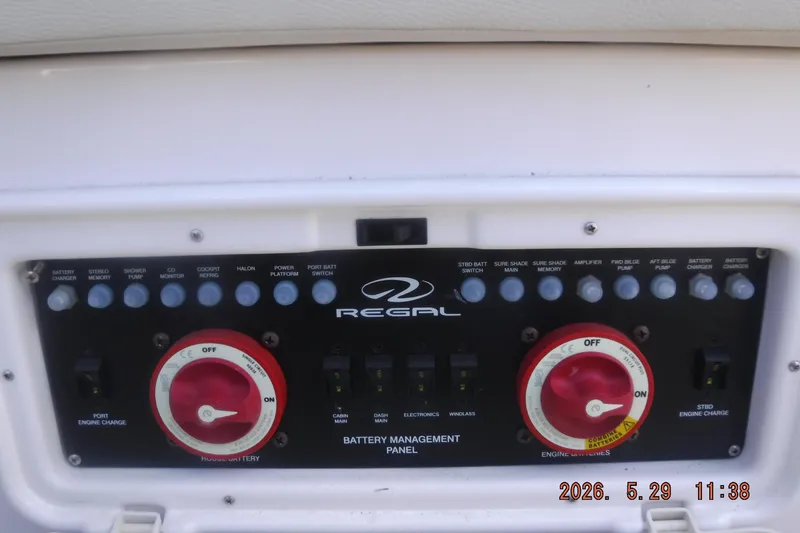 Slide: The Image of Battery management panel of 2020 Regal 33 XO boat with control switches. - 17