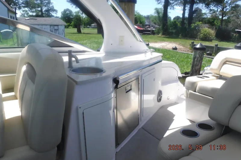 Slide: The Image of Interior of a 2020 Regal 33 XO boat with seating and kitchenette. - 20