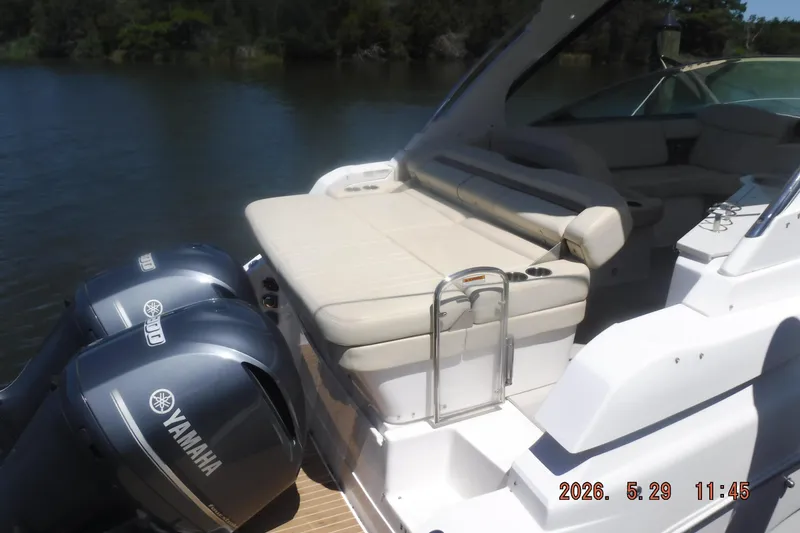 Slide: The Image of 2020 Regal 33 XO boat with Yamaha engines, featuring a spacious rear seating area. - 23