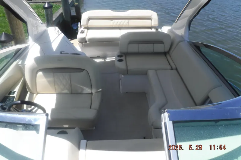 Slide: The Image of 2020 Regal 33 XO boat interior with luxurious seating and open deck view. - 34