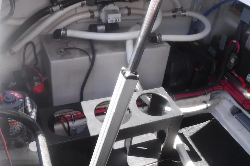 Slide: The Image of Engine compartment of a 2020 Regal 33 XO boat, showcasing mechanical components and wiring. - 50