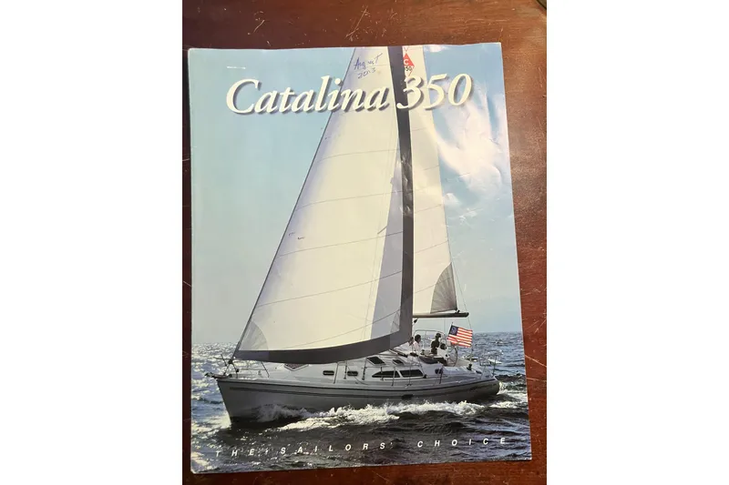 Slide: The Image of Cover of a 2004 Catalina 350 brochure featuring a sailboat on the ocean. - 3