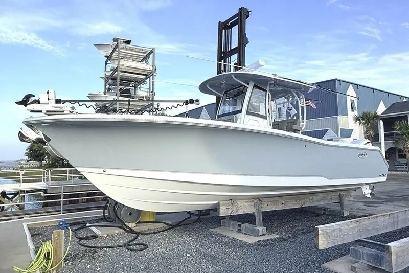 The Image of 2026 Sea Hunt Gamefish 30 Coffin Box boat on display at a marina. - 0