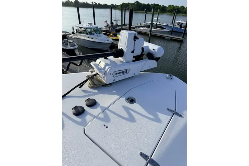 Slide: The Image of 2026 Sea Hunt Gamefish 30 Coffin Box with Minn Kota motor at marina. - 11