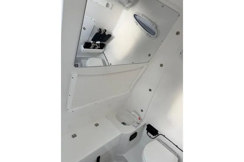 Slide: The Image of Interior of 2026 Sea Hunt Gamefish 30 Coffin Box, featuring compact marine toilet. - 19