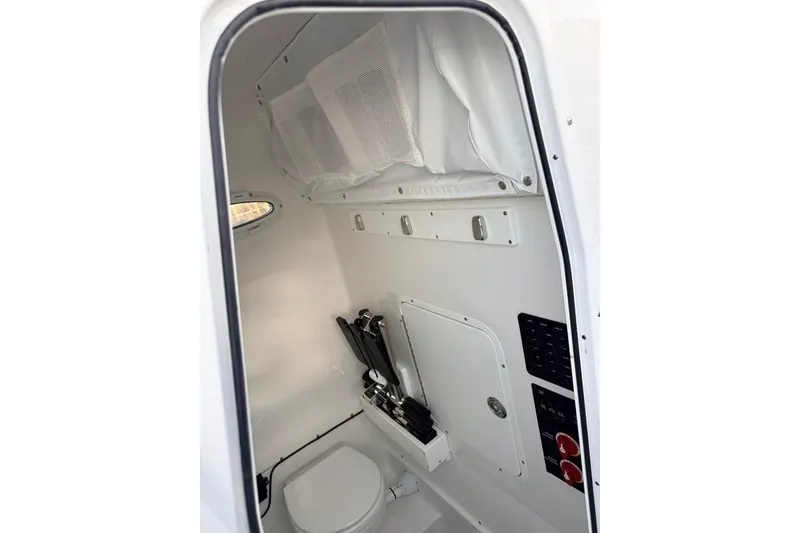 Slide: The Image of Interior of 2026 Sea Hunt Gamefish 30 Coffin Box, featuring compact marine toilet. - 20