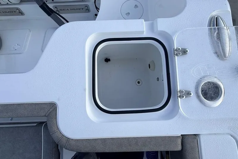 Slide: The Image of 2026 Sea Hunt Gamefish 30 Coffin Box interior view, featuring storage compartment and seating area. - 25