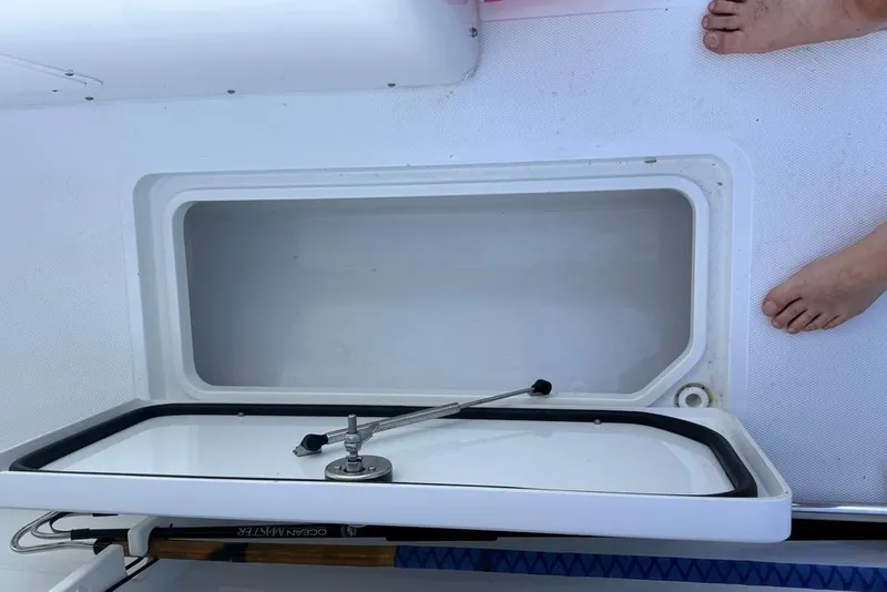 Slide: The Image of Open storage compartment on 2026 Sea Hunt Gamefish 30 Coffin Box boat deck. - 28