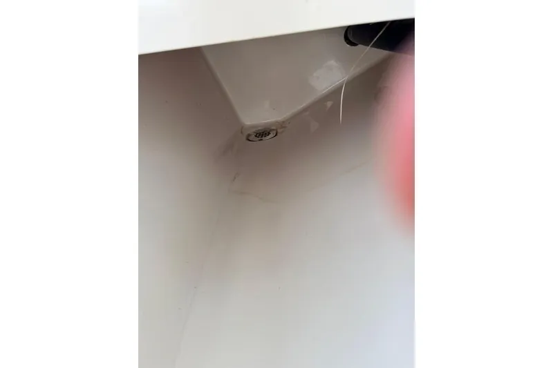 Slide: The Image of Interior of 2026 Sea Hunt Gamefish 30 Coffin Box, showing drain detail. - 29