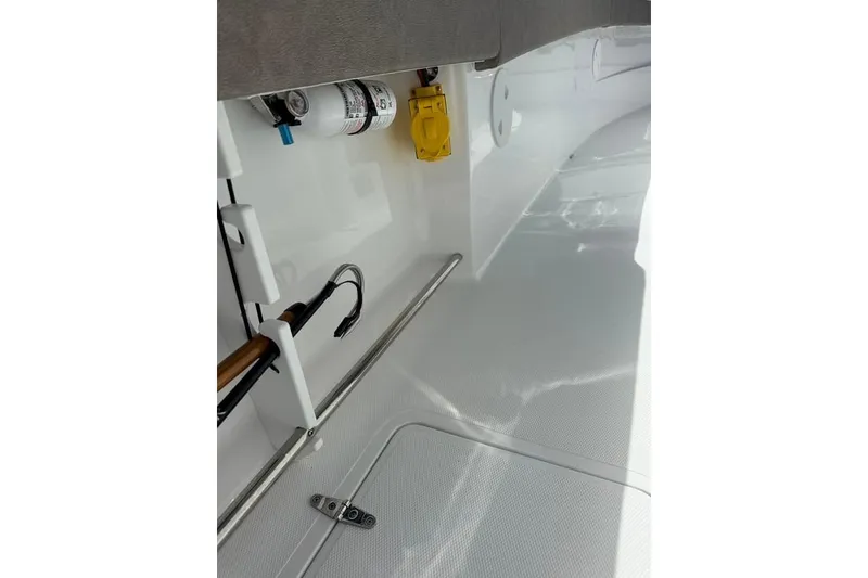 Slide: The Image of Interior view of 2026 Sea Hunt Gamefish 30 Coffin Box boat, showcasing storage and equipment. - 31