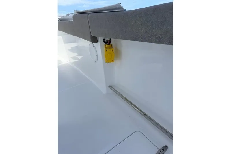 Slide: The Image of 2026 Sea Hunt Gamefish 30 Coffin Box interior detail with yellow electrical outlet. - 32