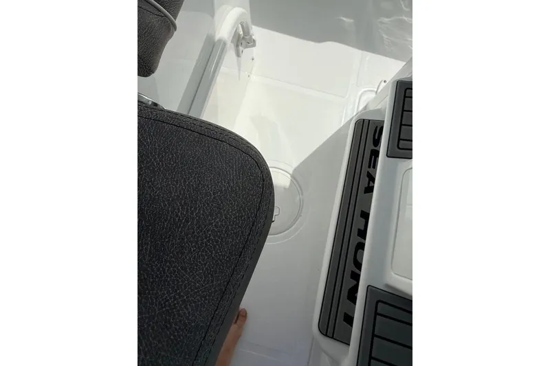 Slide: The Image of Interior view of 2026 Sea Hunt Gamefish 30 Coffin Box boat, featuring seating and deck details. - 33