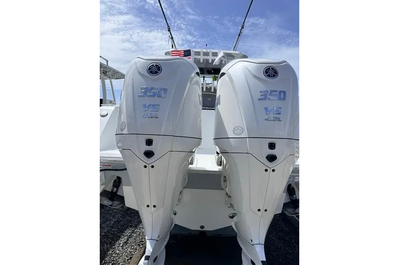 Slide: The Image of Twin Yamaha 350 V6 outboard engines on a 2026 Sea Hunt Gamefish 30 Coffin Box boat. - 4
