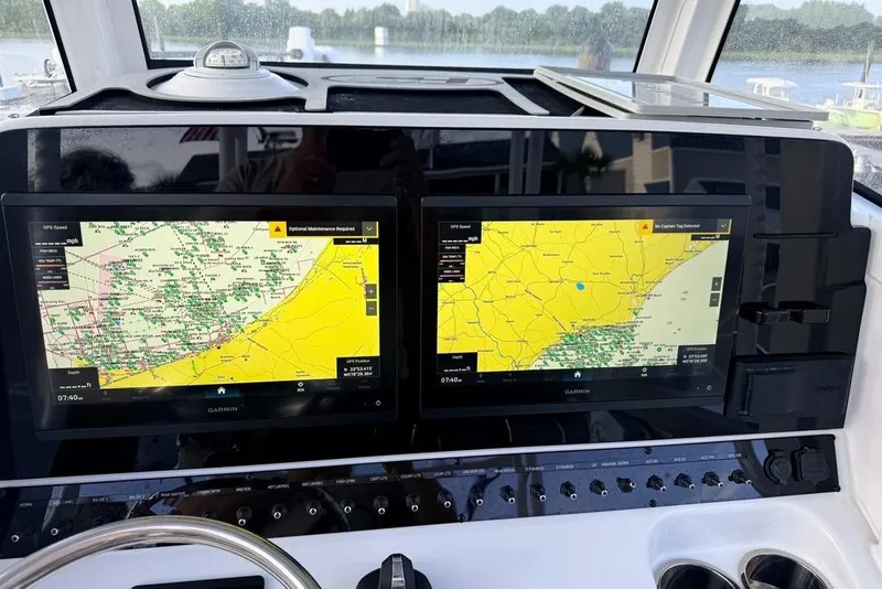 Slide: The Image of Dual Garmin displays on 2026 Sea Hunt Gamefish 30 Coffin Box boat dashboard. - 9