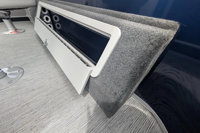 Slide: The Image of Interior view of 2026 Starcraft EX 20 F boat, featuring a storage compartment and carpeted flooring. - 10