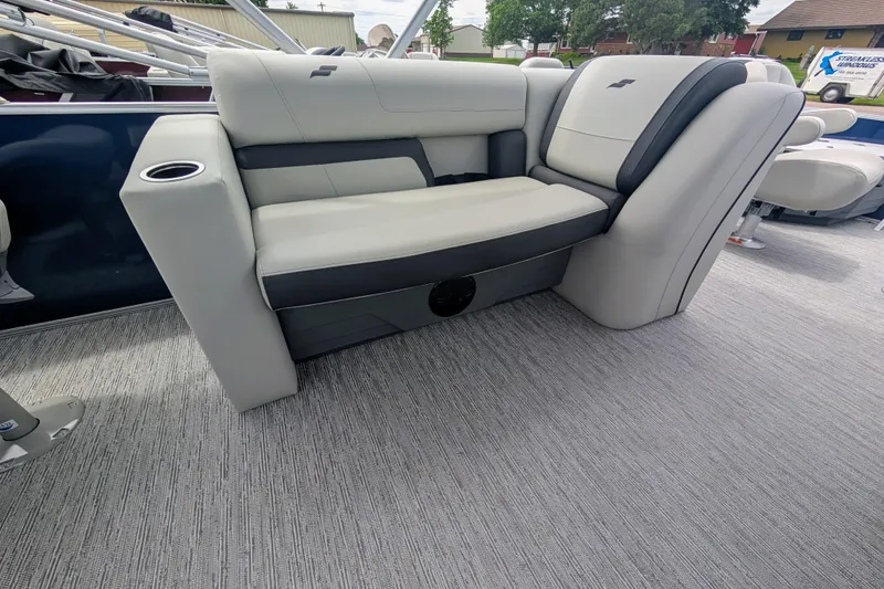 Slide: The Image of 2026 Starcraft EX 20 F boat interior with gray seating and cup holder. - 12