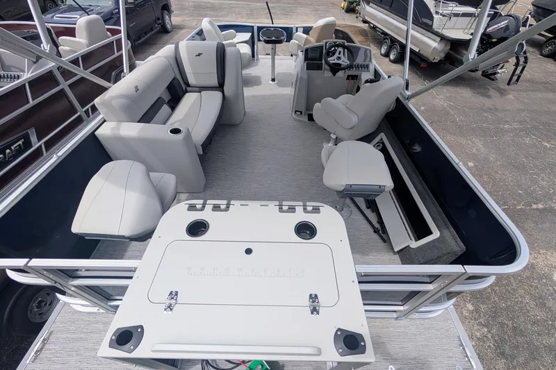 Slide: The Image of 2026 Starcraft EX 20 F pontoon boat interior with seating and helm station. - 4