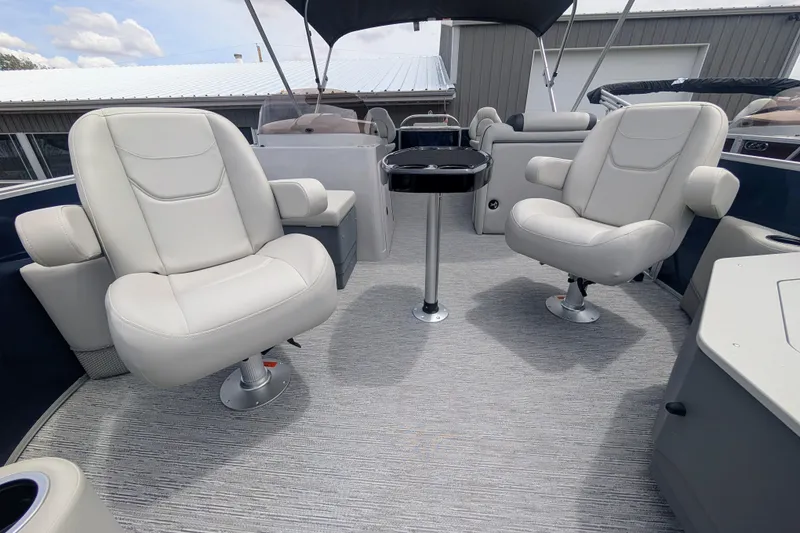 Slide: The Image of 2026 Starcraft EX 20 F boat interior with plush seating and modern design. - 5