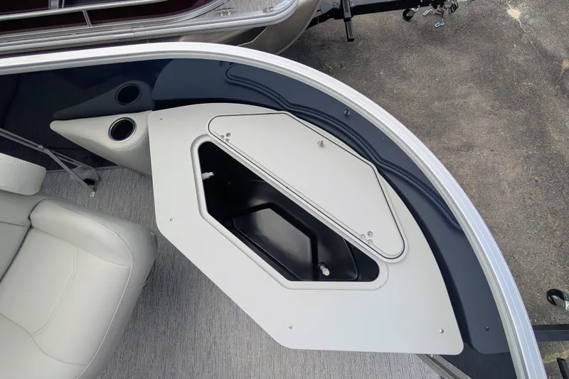 Slide: The Image of 2026 Starcraft EX 20 F boat interior with storage compartment and seating. - 6