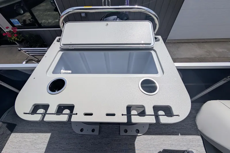 Slide: The Image of 2026 Starcraft EX 20 F boat console with cup holders and storage compartment. - 7