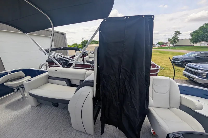 Slide: The Image of 2026 Starcraft EX 20 F pontoon boat interior with seating and privacy curtain. - 8