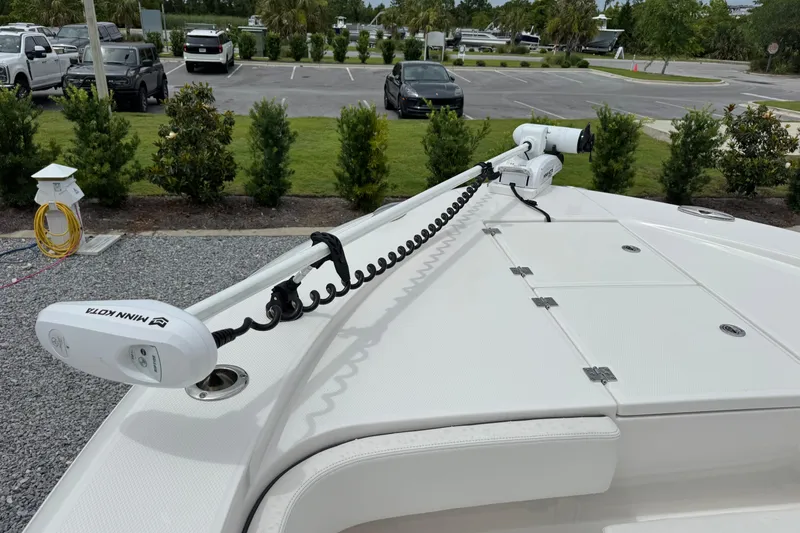Slide: The Image of 2023 Robalo 266 Cayman boat with Minn Kota trolling motor on deck. - 20