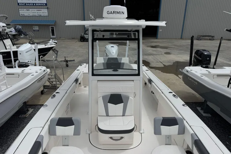 Slide: The Image of 2023 Robalo 266 Cayman boat with Garmin equipment at a sales and service center. - 22