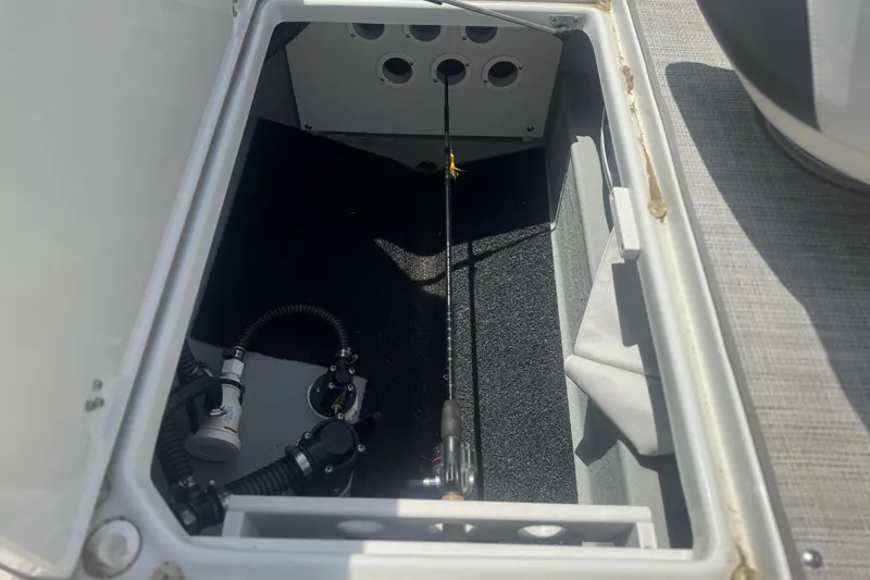 Slide: The Image of Open storage compartment in 2022 Crownline Eclipse E205 XS Fish boat. - 11