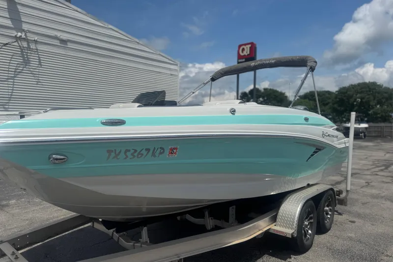 Slide: The Image of 2022 Crownline Eclipse E205 XS Fish boat on trailer, parked outdoors. - 16