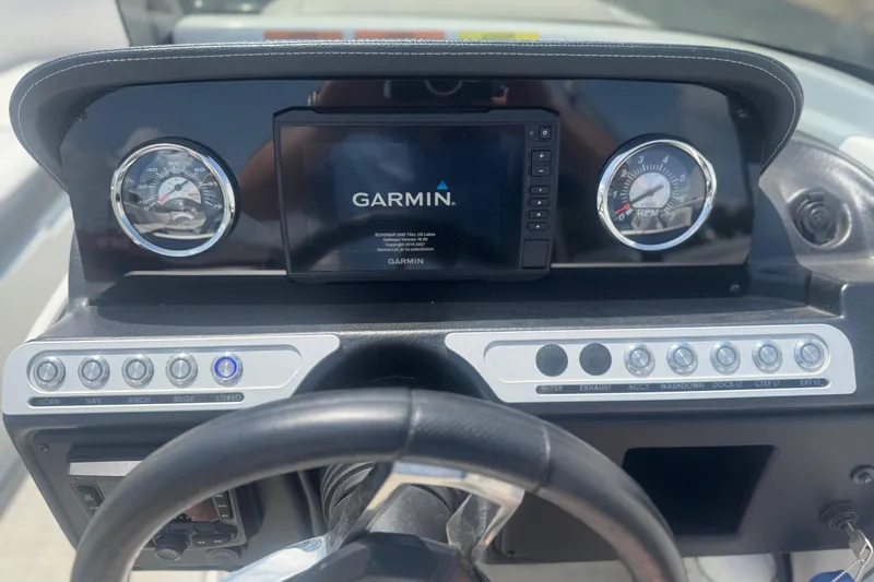 Slide: The Image of Dashboard of 2022 Crownline Eclipse E205 XS Fish with Garmin display and controls. - 17