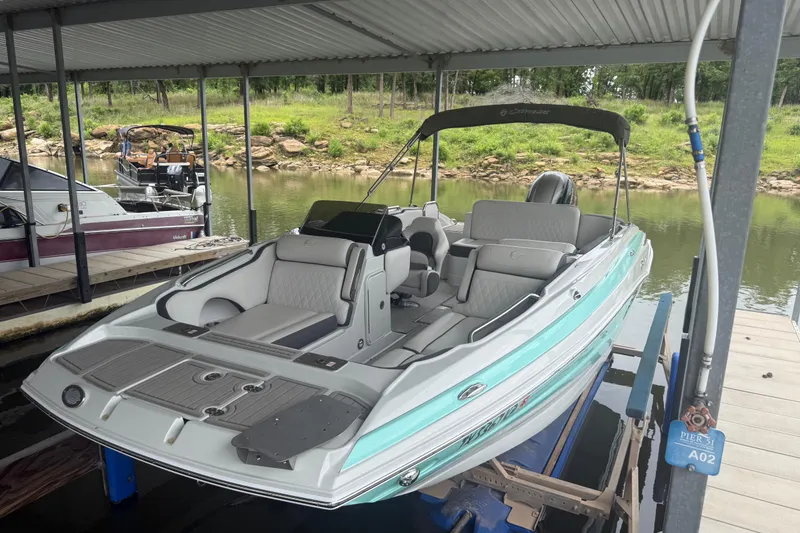 Slide: The Image of 2022 Crownline Eclipse E205 XS Fish boat docked in a covered marina. - 3