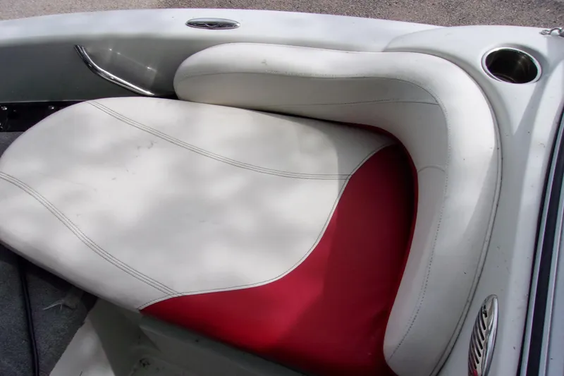 Slide: The Image of 2013 Nitro 290 Sport boat seat with white and red upholstery. - 12
