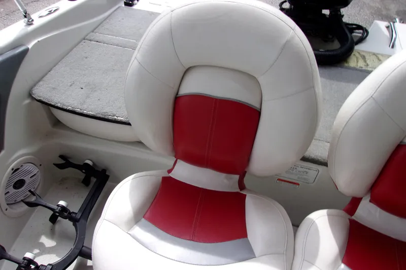 Slide: The Image of Red and white seats in a 2013 Nitro 290 Sport boat interior. - 14