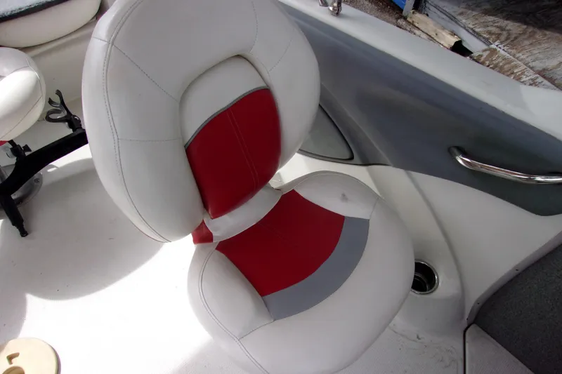 Slide: The Image of White and red boat seat in a 2013 Nitro 290 Sport. - 7