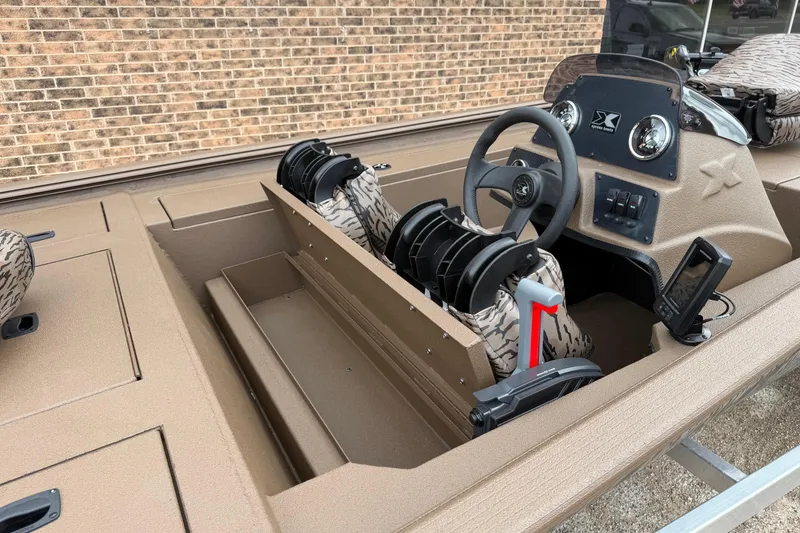 Slide: The Image of 2026 Xpress XP170 boat interior with steering wheel and camouflage seats. - 4