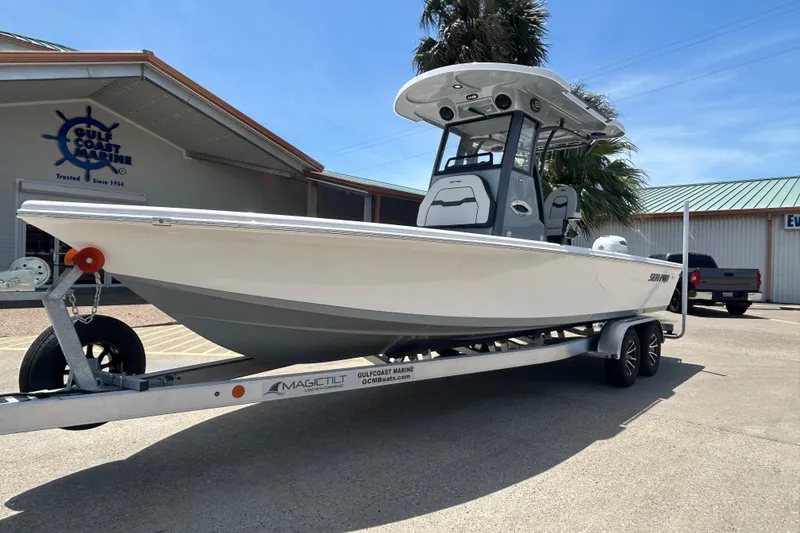 Slide: The Image of 2026 Sea Pro 250 Bay boat on trailer at Gulf Coast Marine dealership. - 1