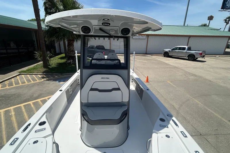 Slide: The Image of 2026 Sea Pro 250 Bay boat in a parking lot, showcasing sleek design and modern features. - 14
