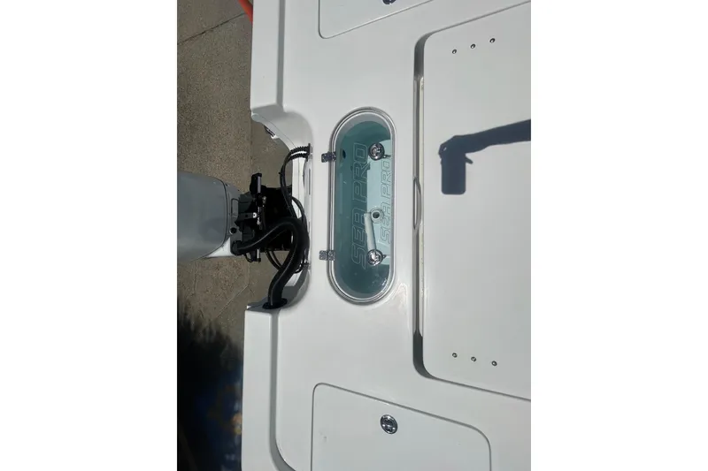 Slide: The Image of 2026 Sea Pro 250 Bay boat deck with logo and equipment. - 22