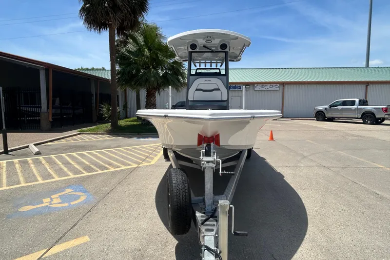 Slide: The Image of 2026 Sea Pro 250 Bay boat on trailer in sunny parking lot. - 3