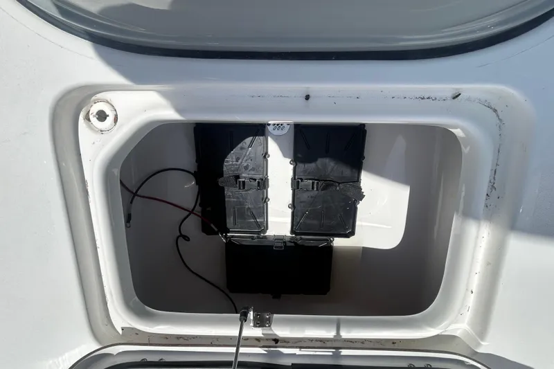 Slide: The Image of Battery compartment of 2026 Sea Pro 250 Bay boat, featuring dual battery setup. - 9