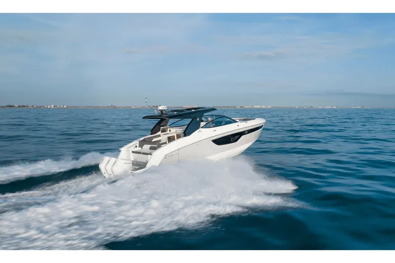 Slide: The Image of 2027 Cruisers Yachts 38GLS-OB on open sea, speeding. - 14