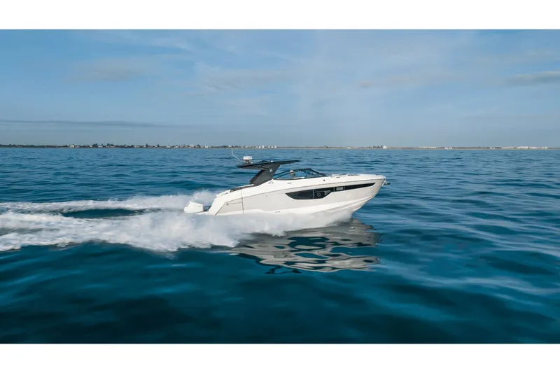 Slide: The Image of 2027 Cruisers Yachts 38GLS-OB cruising on open water. - 15
