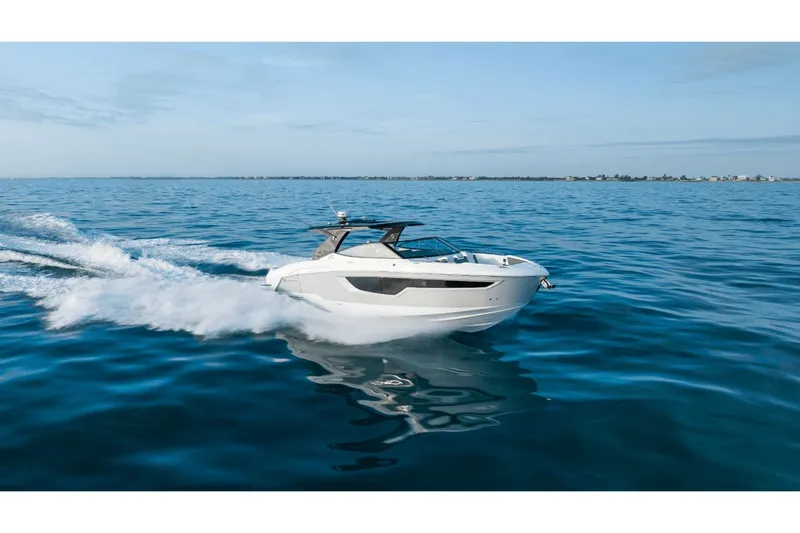 Slide: The Image of 2027 Cruisers Yachts 38GLS-OB on open sea, sleek design. - 16
