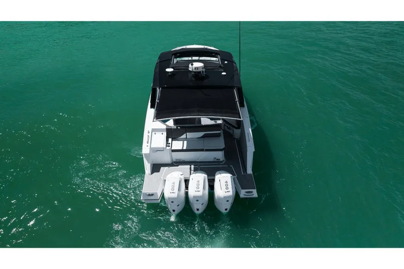 Slide: The Image of Aerial view of 2027 Cruisers Yachts 38GLS-OB on turquoise water. - 33