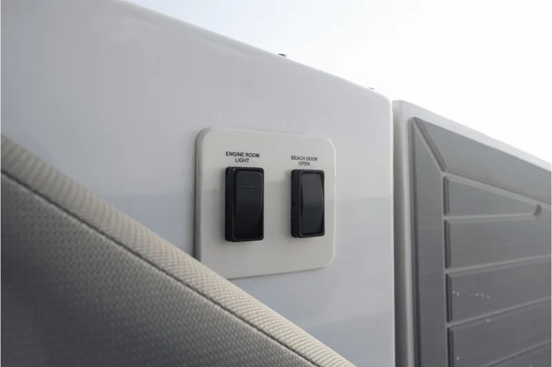 Slide: The Image of Switches in 2027 Cruisers Yachts 38GLS-OB for engine room light and beach door. - 47