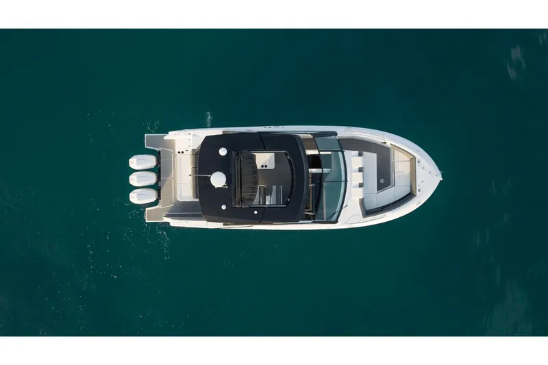 Slide: The Image of Aerial view of 2027 Cruisers Yachts 38GLS-OB on blue water. - 7