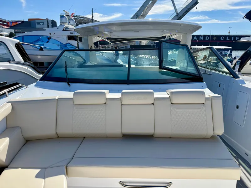 Slide: The Image of The 2027 Cruisers Yachts 38 GLS OB features a modern design with luxurious seating and a spacious deck. - 42
