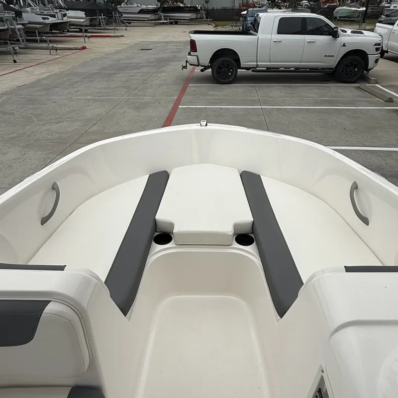 Slide: The Image of Interior view of 2025 Bayliner E18LE with gray seating. - 12