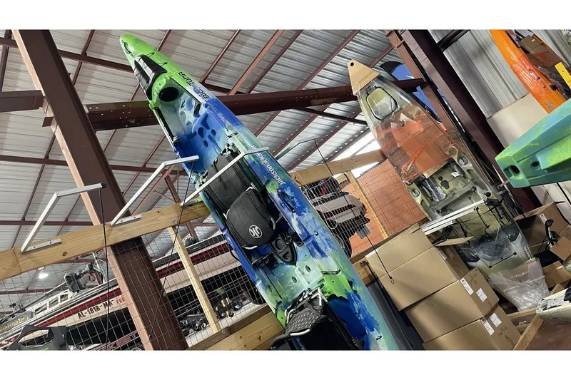 The Image of Jackson Big Tuna Earth 2021 kayak in warehouse. - 1